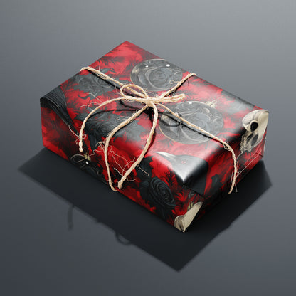A single rectangular gift wrapped in Merry Macabre and tied with natural twine highlights ravens, skulls, and black roses over crimson foliage on a charcoal gray backdrop.