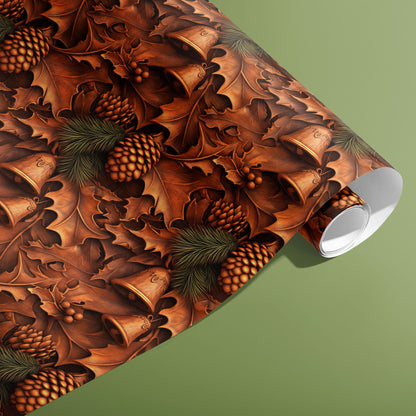 A partially unfurled roll of Timberland Treasures wrapping paper with carved-wood oak leaves, pinecones, and bells in rich browns displayed on a sage green surface.
