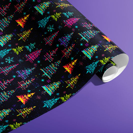 A partially unfurled roll of Glitchmas Trees gift wrap displays stacked, glitchy triangular trees with digital noise on a dark ground against an electric purple background.