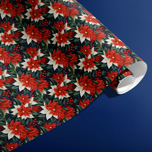 A partially unfurled roll of Classic Poinsettias gift wrap showing layered red and cream poinsettias with green leaves and berries against a rich blue surface.