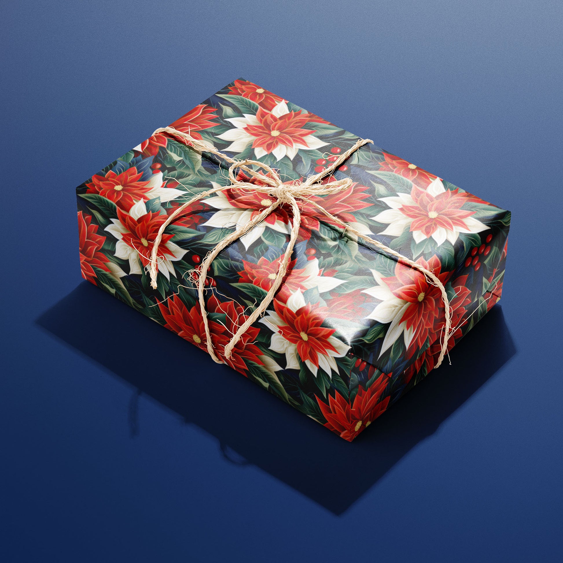 A single box wrapped in Classic Poinsettias paper, decorated with bold poinsettia blooms and berries and tied with rustic twine on a blue backdrop.