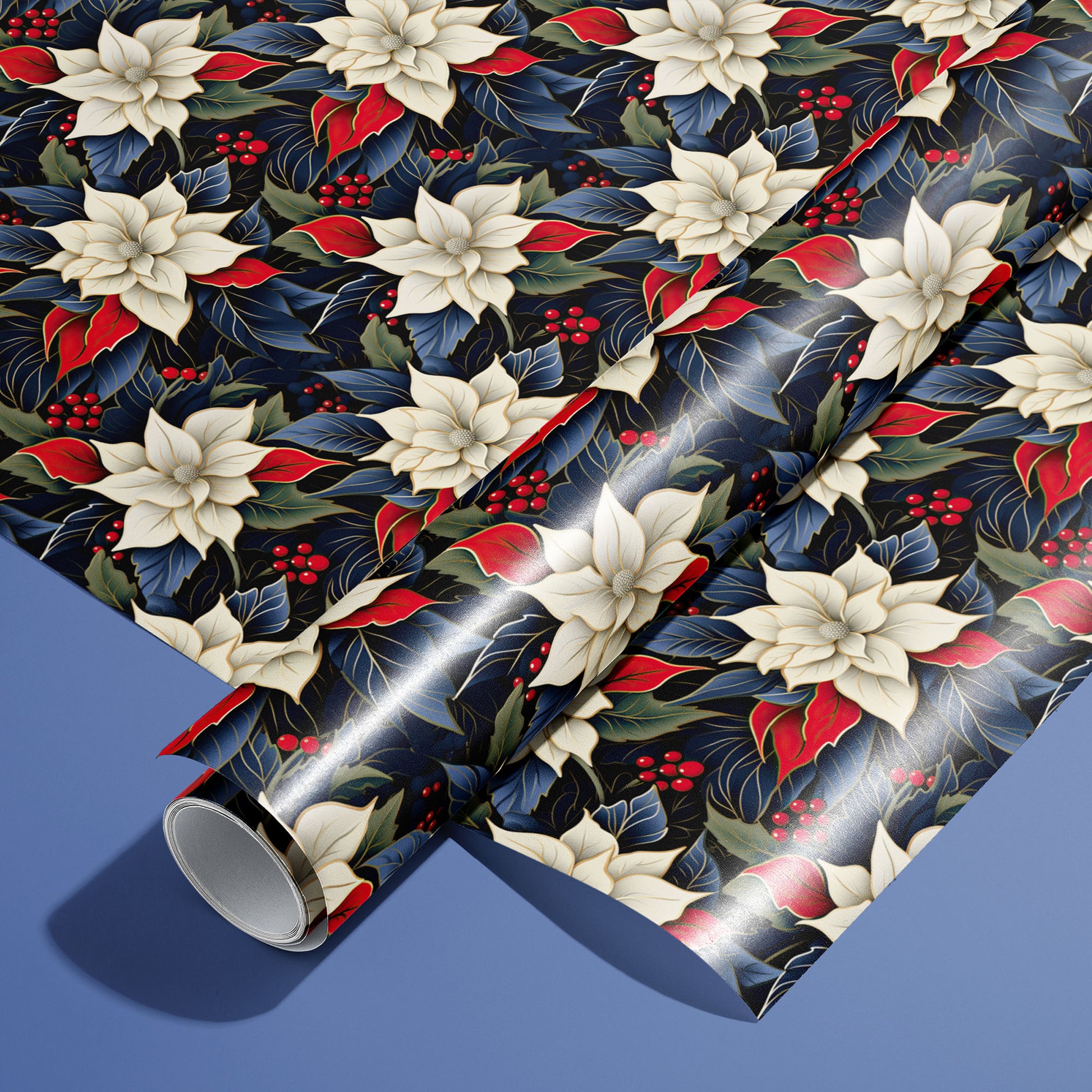A roll of Elegant Poinsettias wrapping paper resting on a matching unrolled sheet, covered in ivory poinsettias, red leaves and berries on dark florals over a periwinkle blue background.