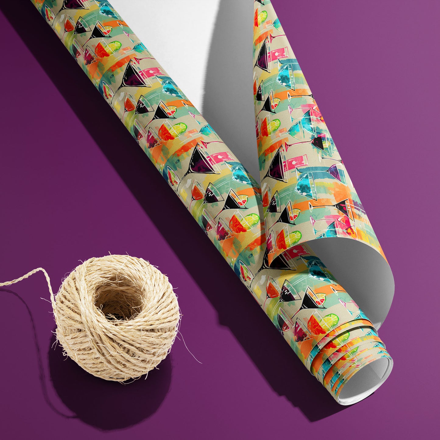 A partially unfurled roll of Martini Memories with the white underside visible sits beside natural twine on a purple surface, revealing vibrant cocktails on a tan ground.