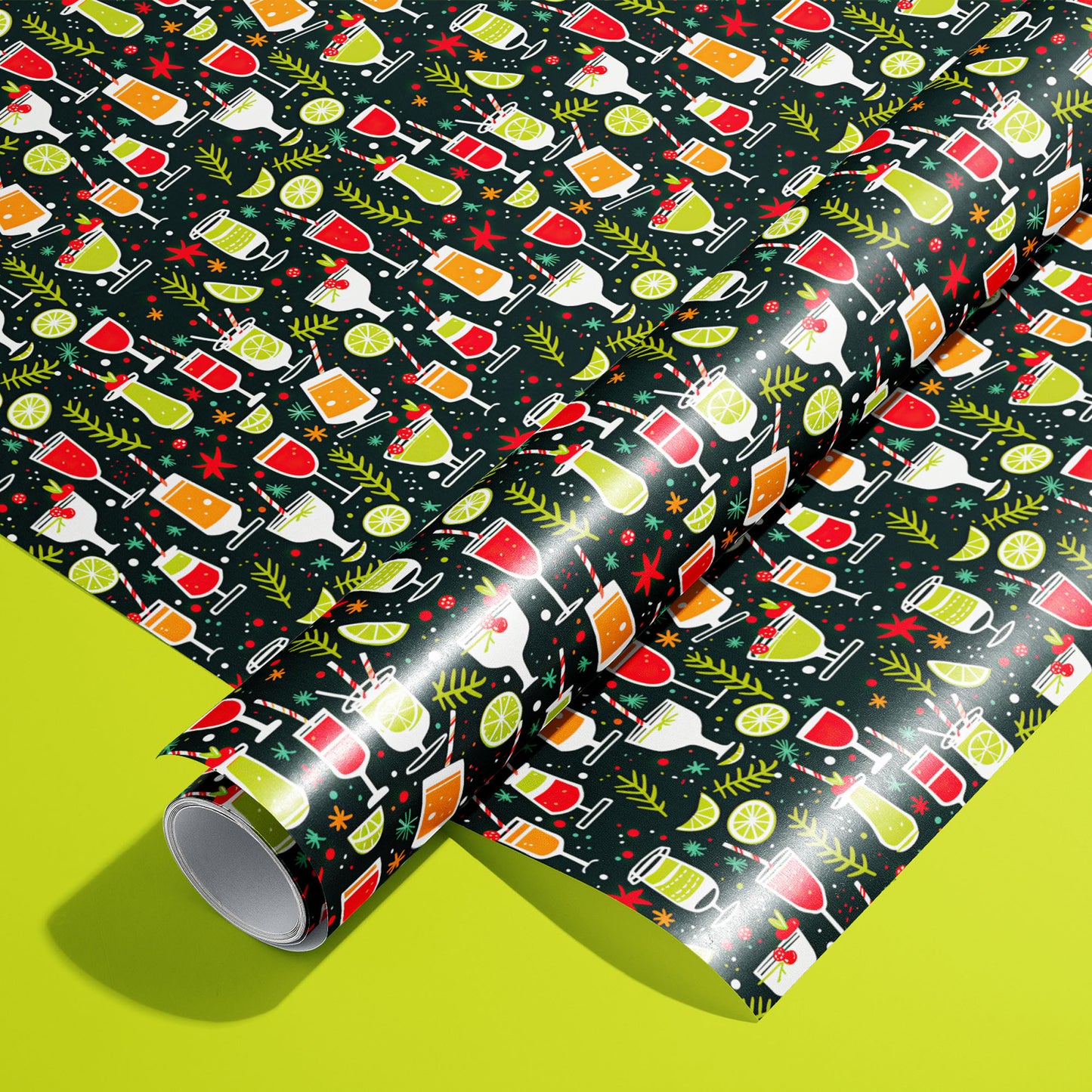 A roll of Christmas Cocktails wrapping paper resting on a matching unrolled sheet, patterned with colorful holiday drinks and citrus on dark paper over a bright lime green background.